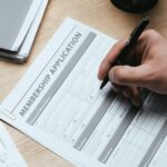 cropped view of man filling in Membership Application Form Register Concept